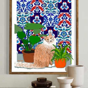 May include: A framed illustration of a ginger cat sitting in front of a wall with blue and white patterned tiles. The cat is surrounded by two potted plants, one with green leaves and the other with a fern. The illustration is signed "From Lulu".