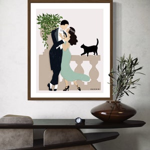 May include: A framed illustration of a couple dancing on a balcony with a black cat watching them. The illustration is in a minimalist style with muted colors and a simple background. The text "FROM BLUE" is at the bottom of the illustration.