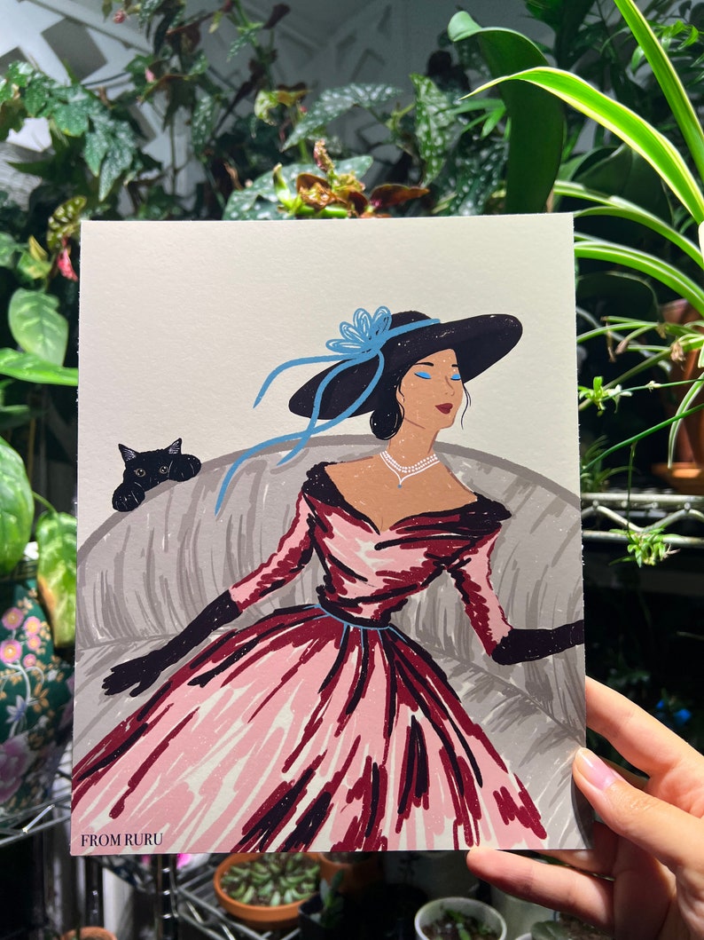 May include: A woman in a pink and red dress with a black hat and blue ribbon sits on a couch with a black cat. The woman has blue eyeshadow and is wearing a pearl necklace. The image is titled "FROM RURU".