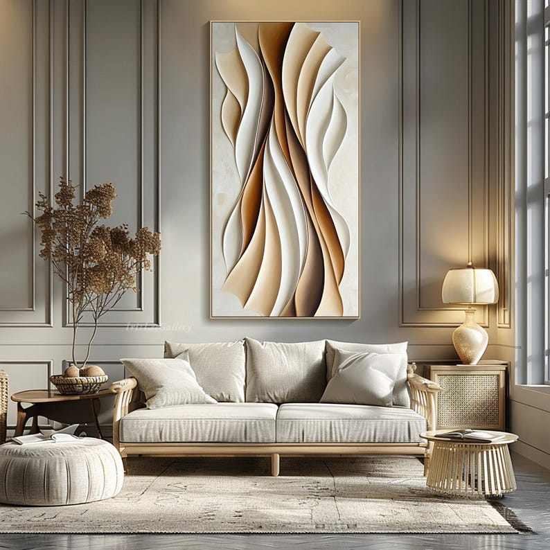 May include: Abstract wall art featuring a modern design with brown and white curved lines. The artwork is framed and hanging on a wall in a living room setting.