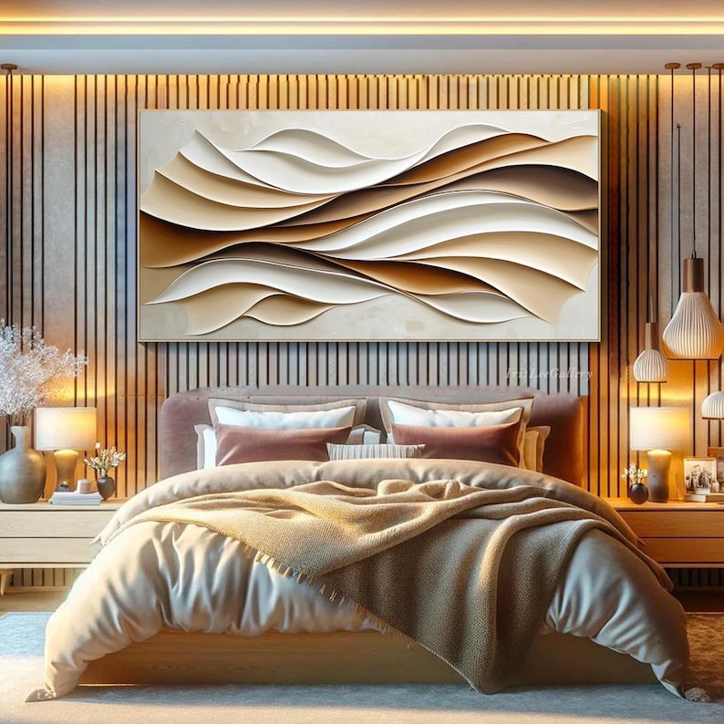 May include: Abstract wall art featuring a modern design of overlapping brown and white waves. The artwork is displayed above a bed with a beige headboard and a brown blanket.