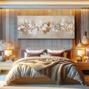 May include: A large rectangular canvas art piece featuring a floral design with gold and white textured elements. The artwork is displayed above a bed with a neutral color palette, creating a serene and elegant bedroom setting.