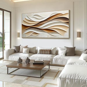 May include: Abstract wall art featuring a modern design of overlapping waves in shades of brown, beige, and white. The artwork is displayed above a white sectional sofa in a contemporary living room.