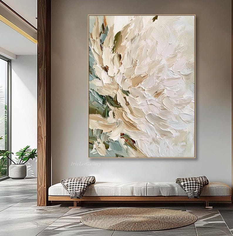 May include: A large rectangular canvas painting featuring thick, textured impasto brushstrokes in shades of cream, off-white, beige, and muted sage green. The abstract composition displays layered paint application creating a floral-like effect.