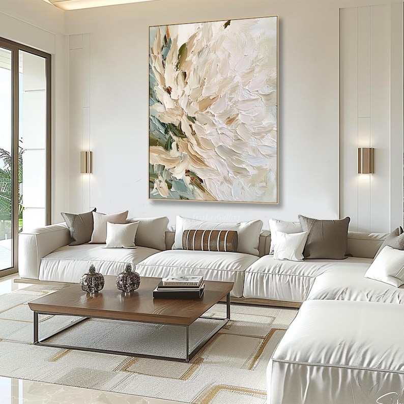 May include: A large rectangular canvas painting featuring thick, textured impasto brushstrokes in shades of cream, white, beige, and muted sage green. The artwork displays an abstract floral composition with layered paint application.