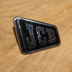 Vintage JCB farm equipment brooch - enamel tractor advertising badge