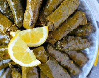 Organic Vegan Homemade Turkish Stuffed Grape Leaves Made With Olive Oil,less spicy.salt,rice,lemon,dill,onion,black pepper water.
