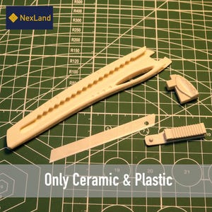 May include: A beige ceramic and plastic craft knife set, including a long knife body, a blade, and two additional parts. The text "Only Ceramic & Plastic" is visible. The set is on a green cutting mat.