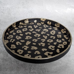 Black and gold leopard print round decorative tray