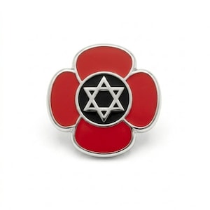 May include: A circular metal pin featuring a four-petaled red enamel flower design. At the centre of the flower is a black circular inlay containing a silver-toned Star of David. The entire piece is outlined in a polished silver-coloured metal border.