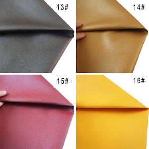 May include: Four samples of faux leather in different colors: black, gold, red, and yellow. Each sample is folded in half to show the texture. The samples are labeled with numbers 13, 14, 15, and 16.