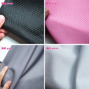 May include: Four fabric swatches in black, pink, gray, and white. Each swatch has a textured surface with small raised dots.