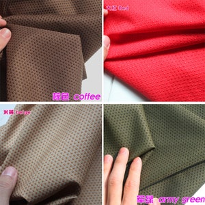 May include: Four fabric swatches with a textured dot pattern. The swatches are in the colors beige, coffee, red, and army green.