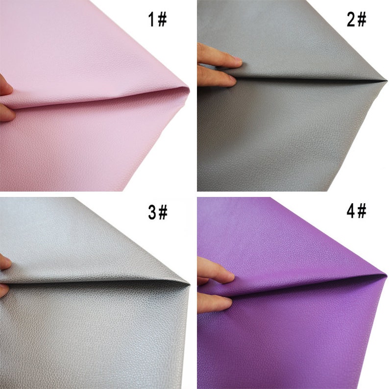 May include: Four samples of faux leather in different colors: pink, gray, silver, and purple. Each sample is folded in half and held by a hand.