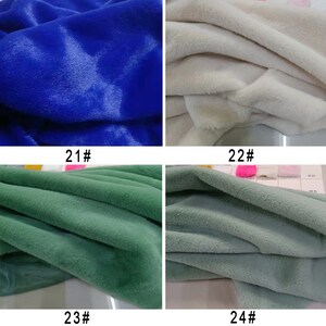 May include: Four fabric swatches in different colors: blue, white, green, and light green. The swatches are labeled with numbers 21, 22, 23, and 24.