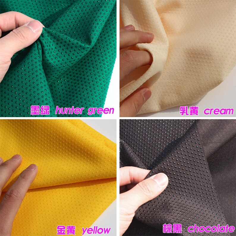 May include: Four fabric swatches with a textured, dotted surface. The swatches are hunter green, cream, yellow, and chocolate.