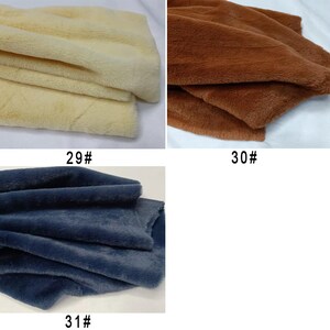 May include: Three fabric swatches, one is a light beige, one is a brown, and one is a dark blue. The swatches are labeled 29#, 30#, and 31#.