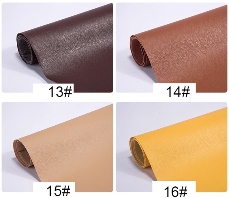 May include: Four samples of faux leather in different colors: brown, dark brown, beige, and yellow. Each sample is rolled up and labeled with a number.