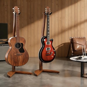 May include: Two wooden guitar stands holding instruments. On the left, an acoustic guitar with a dark wood grain finish. On the right, an electric guitar with a red and black sunburst finish, featuring two pickups, four control knobs, and a toggle switch.