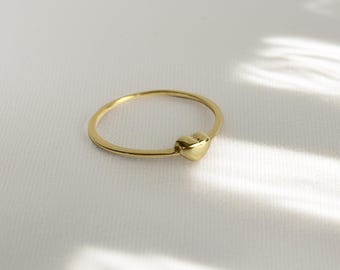 Heart Ring: Delicate gold ring with a heart