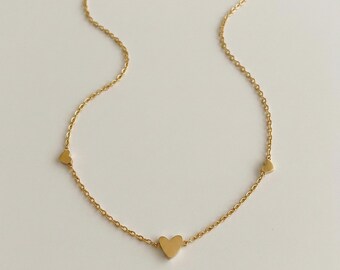 Gold heart necklace: Delicate necklace with 3 heart pendants