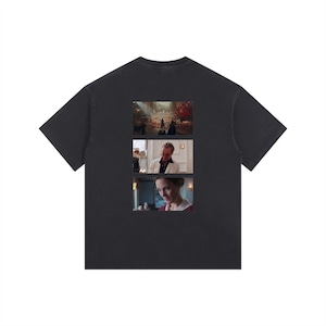 May include: Dark gray t-shirt featuring three movie stills. The top image shows a crowded outdoor scene, the middle image features a man in a white suit, and the bottom image shows a woman in a red dress.