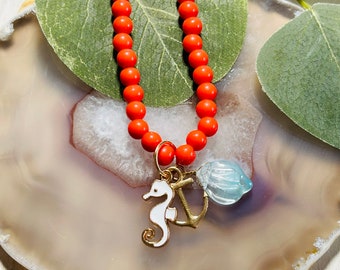 Kids Orange Beaded Seahorse, Anchor, And Shell Charm Necklace, Kids Gold Necklace