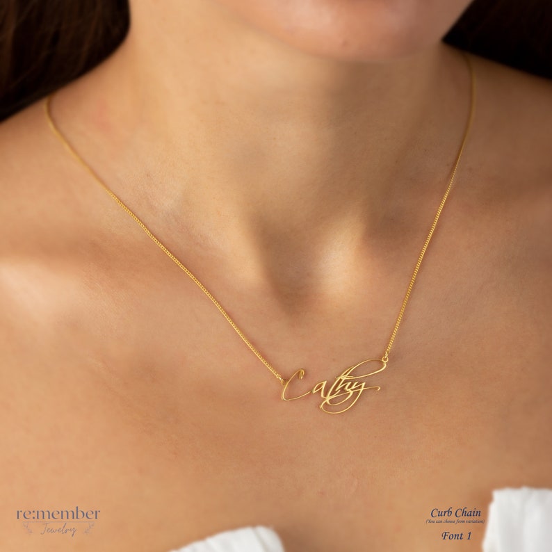 Sterling silver custom name necklace with Cathy in elegant cursive font, displayed on a model wearing a delicate curb chain. Personalized jewelry, ideal for gifts or everyday wear. Customizable with different names and fonts