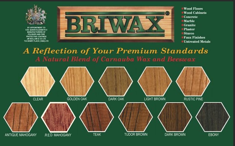 May include: A green and brown label with the text "BRIWAX" in large white letters. The label also includes the text "A Reflection of Your Premium Standards" and "A Natural Blend of Carnauba Wax and Beeswax". Below the text are 12 hexagonal color swatches labeled with different wood stain colors, including Clear, Golden Oak, Dark Oak, Light Brown, Rustic Pine, Antique Mahogany, Red Mahogany, Teak, Tudor Brown, Dark Brown, and Ebony.
