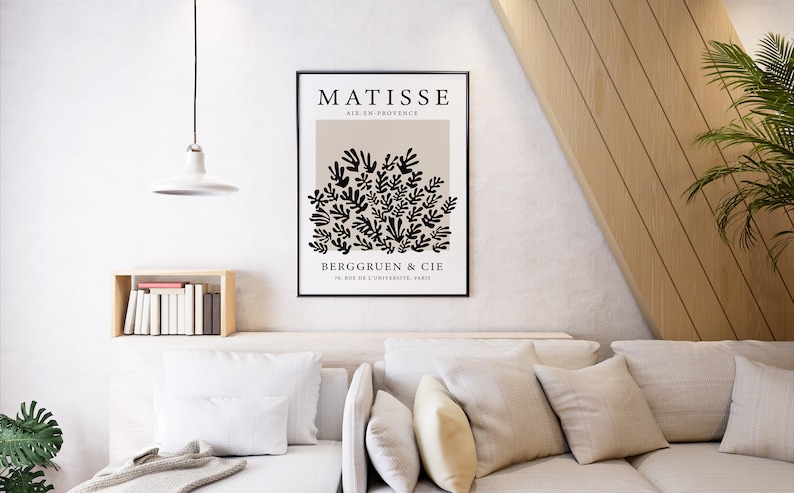 May include: A black and white poster with the text "MATISSE AIX-EN-PROVENCE" and a black and white illustration of a cluster of leaves. The text "BERGGREEN & CIE 76, RUE DE L'UNIVERSITE, PARIS" is at the bottom of the poster.