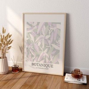 May include: A framed print with a botanical design in shades of green, purple, and white. The print has the text "BOTANIQUE LE FORMES D'ART" at the bottom.