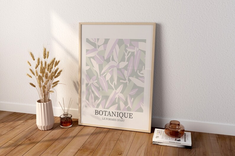 May include: A framed print with a botanical design in shades of green, purple, and white. The print has the text "BOTANIQUE LE FORMES D'ART" at the bottom.