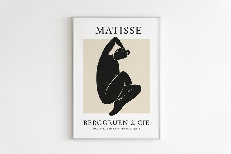 May include: A black and white minimalist art print featuring a stylized figure in a seated pose. The print has the text "MATISSE" at the top and "BERGGRUEN & CIE NO. 70, RUE DE L'UNIVERSITE, PARIS" at the bottom.