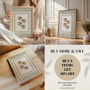 May include: A framed print featuring a coffee cup design. The artwork has a beige background with four brown coffee cups. The frame is light brown with a green and white striped border. The text "BUY MORE & SAVE" is also visible.