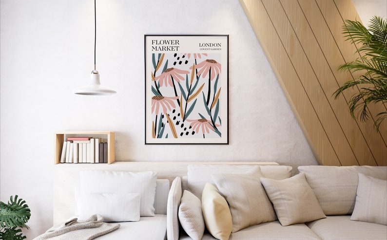 May include: A framed print with a floral design featuring pink flowers, green leaves, and black and gold accents. The print has the text "FLOWER MARKET LONDON COVENT GARDEN" at the top.