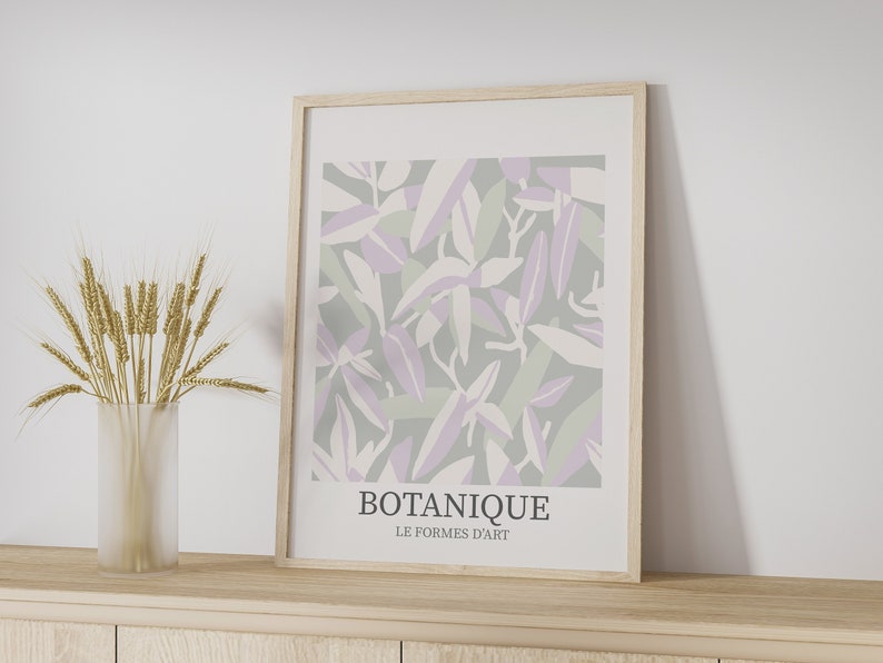 May include: A framed print with a botanical design featuring abstract leaves in shades of purple, green, and white. The print has the text "BOTANIQUE LE FORMES D'ART" at the bottom.