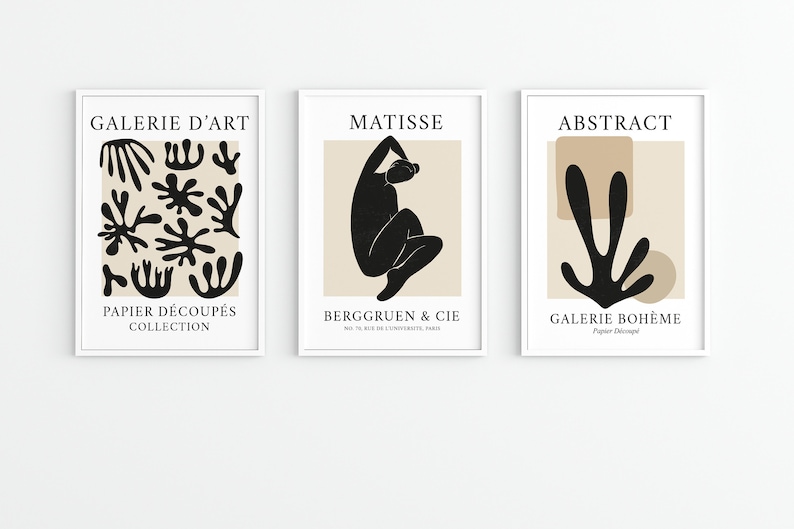 May include: Three framed art prints with black and white abstract designs on a beige background. The prints are titled "Galerie d'Art", "Matisse", and "Abstract".