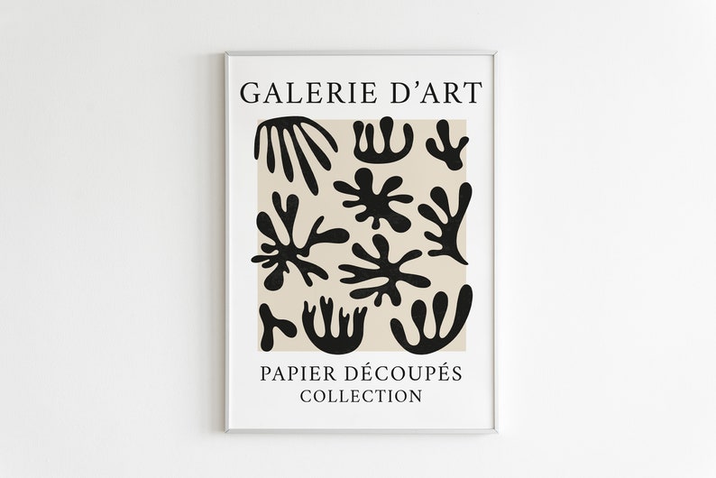 May include: A beige poster with black abstract shapes and the text "GALERIE D'ART PAPIER D&Eacute;COUP&Eacute;S COLLECTION".