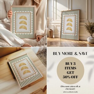 May include: A framed print with a light wood finish, displaying three croissants within a decorative border. The background features green and white stripes. The image also includes text that says "BUY MORE & SAVE".