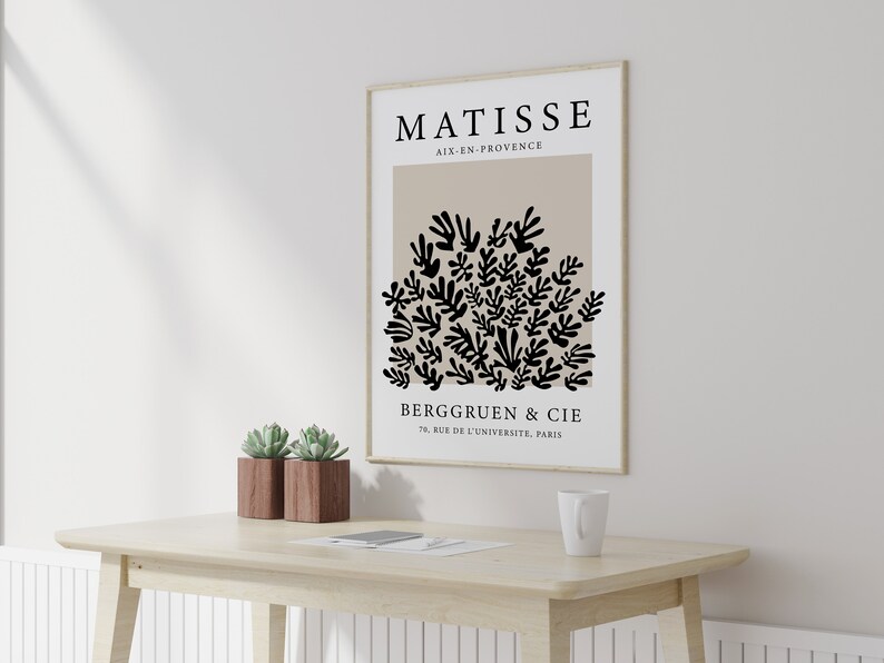 May include: A black and white art print featuring a stylized floral design with the text "MATISSE AIX-EN-PROVENCE BERGGRUEN & CIE 70, RUE DE L'UNIVERSITE, PARIS".