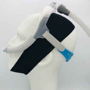 This is an image of one mannequin with our CPAP chin strap on. The mannequin is also wearing a a “nose pillows” style CPAP head gear in order to show you how our CPAP chin straps fit.