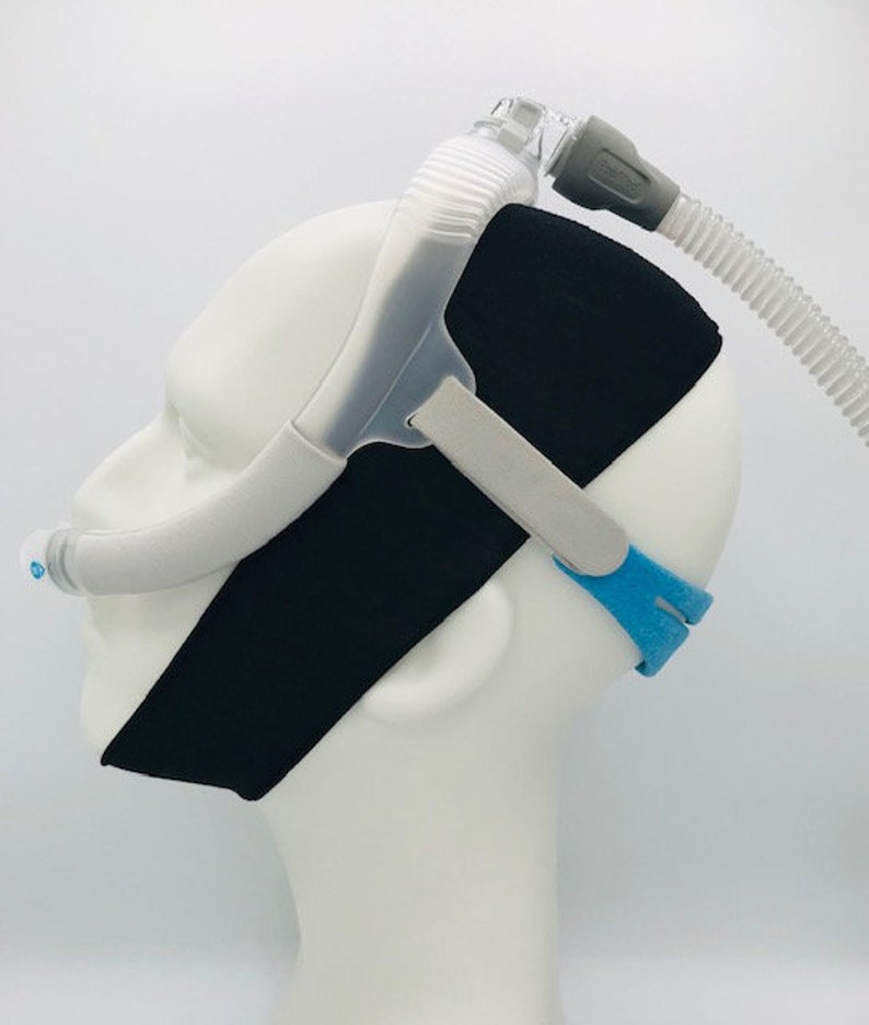 This is an image of one mannequin with our CPAP chin strap on. The mannequin is also wearing a a “nose pillows” style CPAP head gear in order to show you how our CPAP chin straps fit.