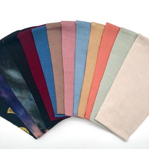 This is an image of the chin straps arranged in a fan shape, showcasing the different colors and patterns.