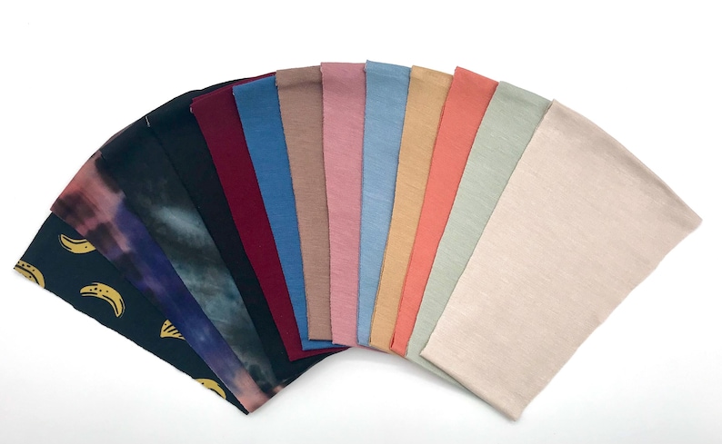 This is an image of the chin straps arranged in a fan shape, showcasing the different colors and patterns.