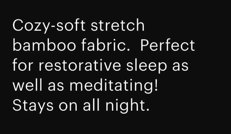 May include: Text on a black background reads: "Cozy-soft stretch bamboo fabric. Perfect for restorative sleep as well as meditating! Stays on all night."