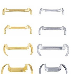 May include: Four pairs of orthodontic bands, two pairs are gold and two pairs are silver. The bands are designed to hold teeth in place during orthodontic treatment.