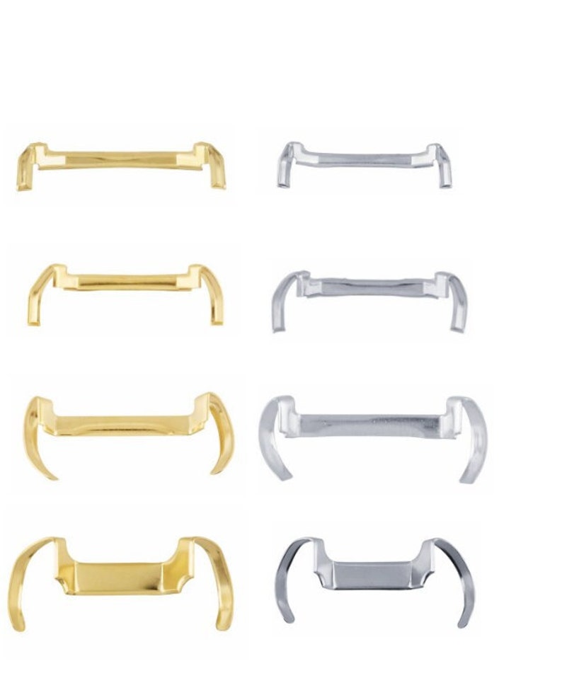 May include: Four pairs of orthodontic separators, two gold and two silver. The separators are designed to create space between teeth for braces.