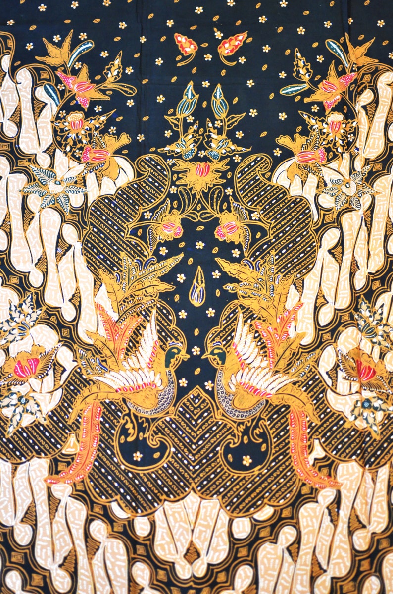 May include: Black fabric with a traditional Indonesian batik pattern. The design features intricate floral motifs, birds, and geometric shapes in gold, white, and red.
