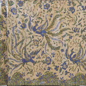 May include: A cream-colored fabric with a repeating pattern of blue and green peacocks and floral designs.