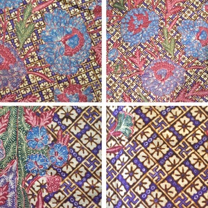 Könnte beinhalten: Nahaufnahme eines bunten Stoffes mit einem sich wiederholenden Muster aus Blumen und geometrischen Formen. Der Stoff ist eine Mischung aus Blau, Rot, Grün und Braun.